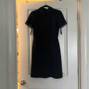 Karl Lagerfeld black midi dress with lace detail on neck and sleeves.